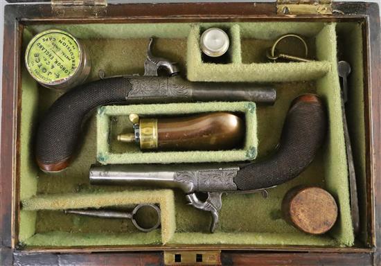 A cased pair of early 19th century steel pocket pistols, pistols 6.5in., case 10.5in.